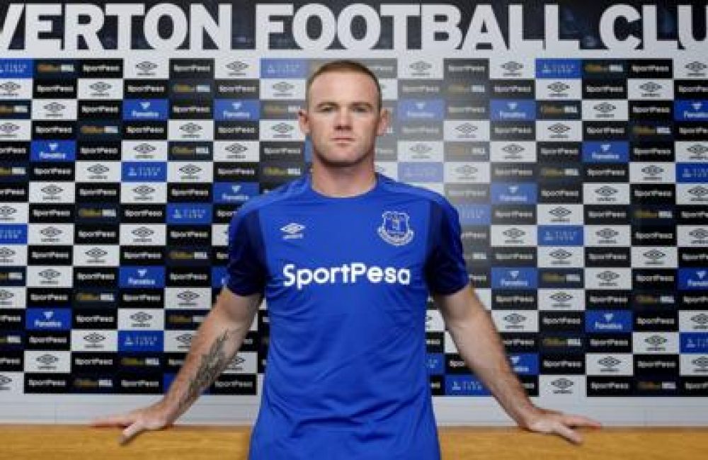 Wayne Rooney flexing the Everton banner