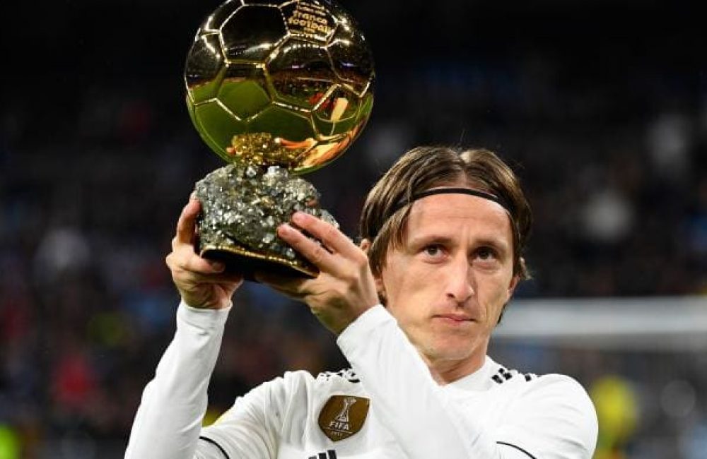 Luka Modric poses with his Ballon d'Or trophy.