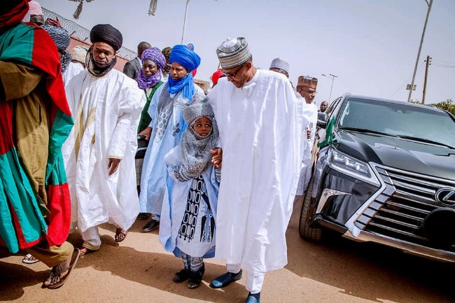 President Buhari being welcome at the mosque