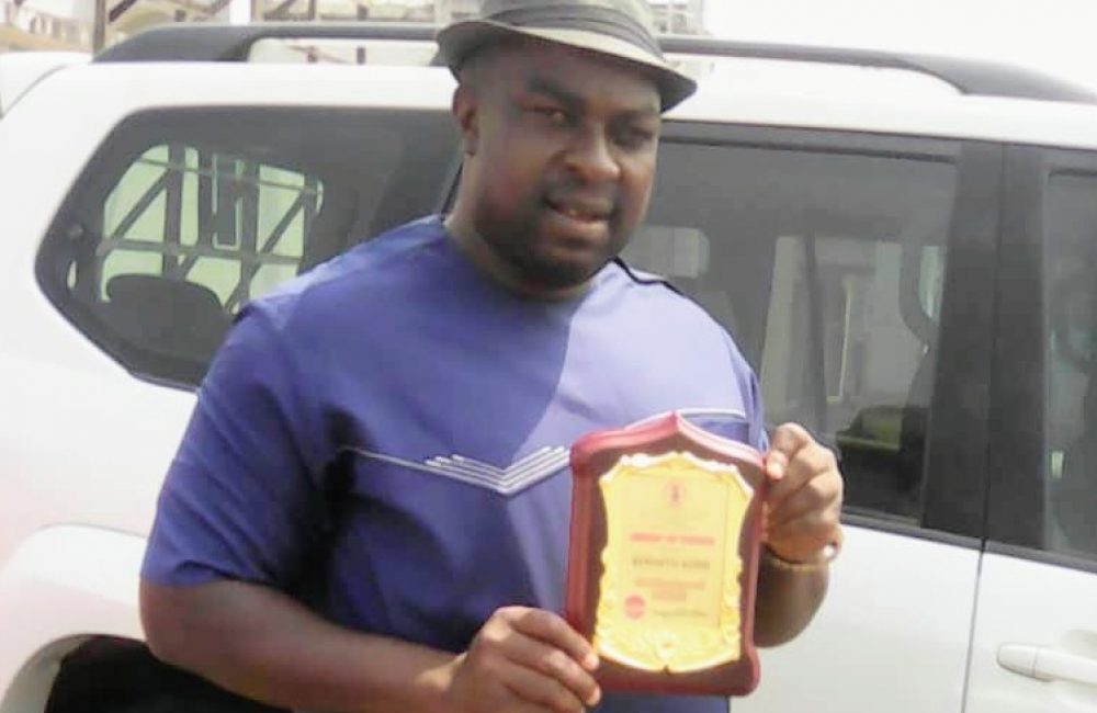 Simeon Korie, Executive Director, receiving an Award of Chief Employment of Labor, Imo State from Imo ENTRACO