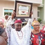 TJ Ehirim with his "Man of the Year" award from Umuaka Times on Wednesday, December 30, 2020