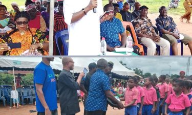 Oganihu Eziudo doles out educational materials to students