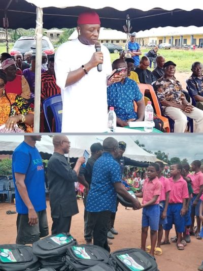 Oganihu Eziudo doles out educational materials to students