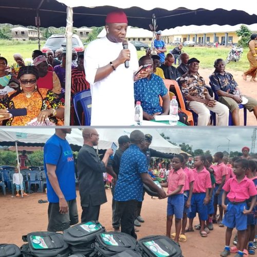 Oganihu Eziudo doles out educational materials to students