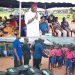 Oganihu Eziudo doles out educational materials to students